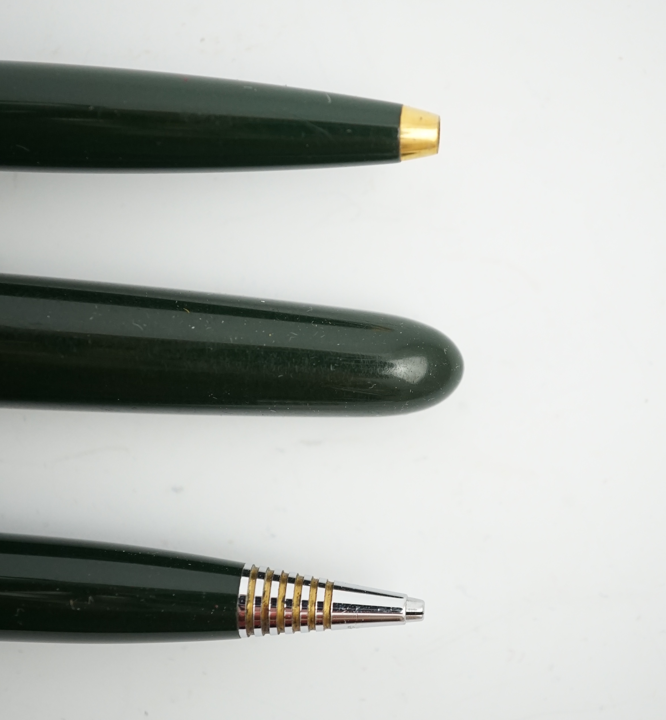 A Parker '51' Aerometric fountain pen, ball pen and pencil set in rare 'Forest Green'